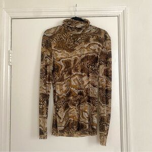 Beautiful Ganni stretch mesh turtleneck in abstract animal print